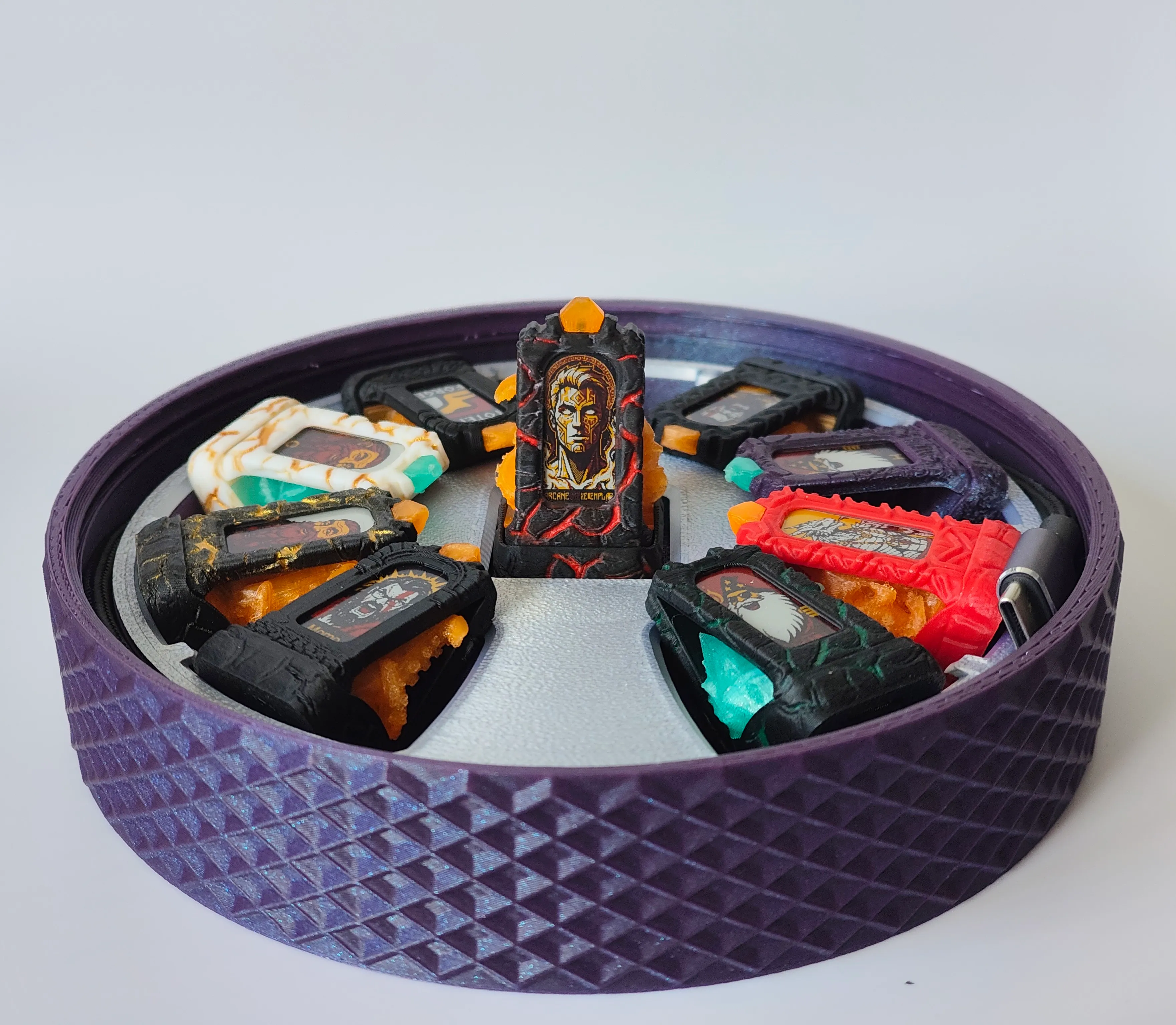 Totems arranged around the circular base tray with one docked at the center